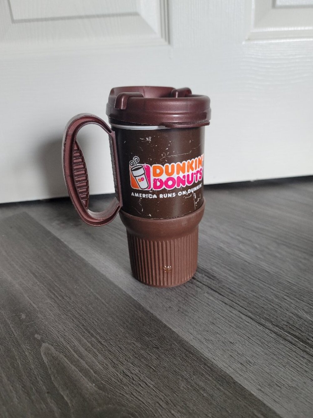 Medium sized brown plastic Dunkin Donuts mug
